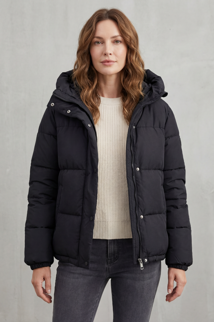 Stylish women's cream quilted puffer jacket, perfect for casual everyday warmth & fashion.