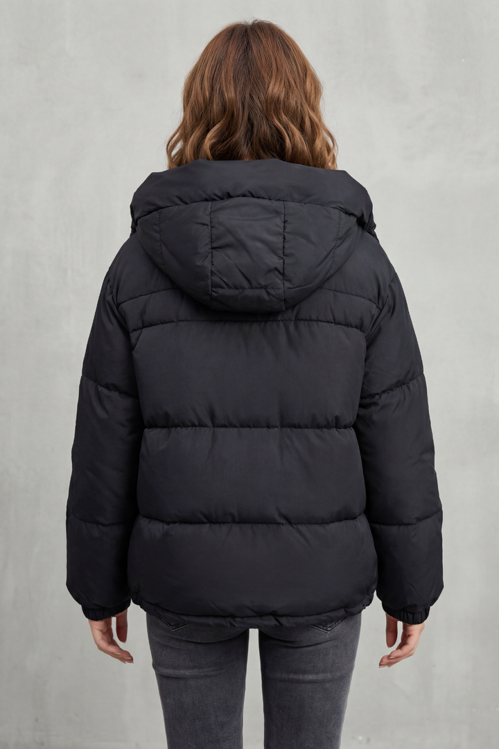 Versatile women's quilted puffer jacket, offering warmth and modern style for any season.