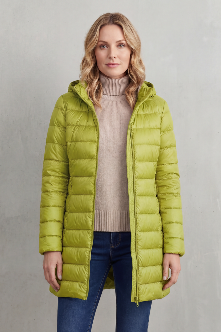 Active women's hooded puffer jacket. Lightweight, ultra-warm, and packable for outdoor activities & travel comfort.