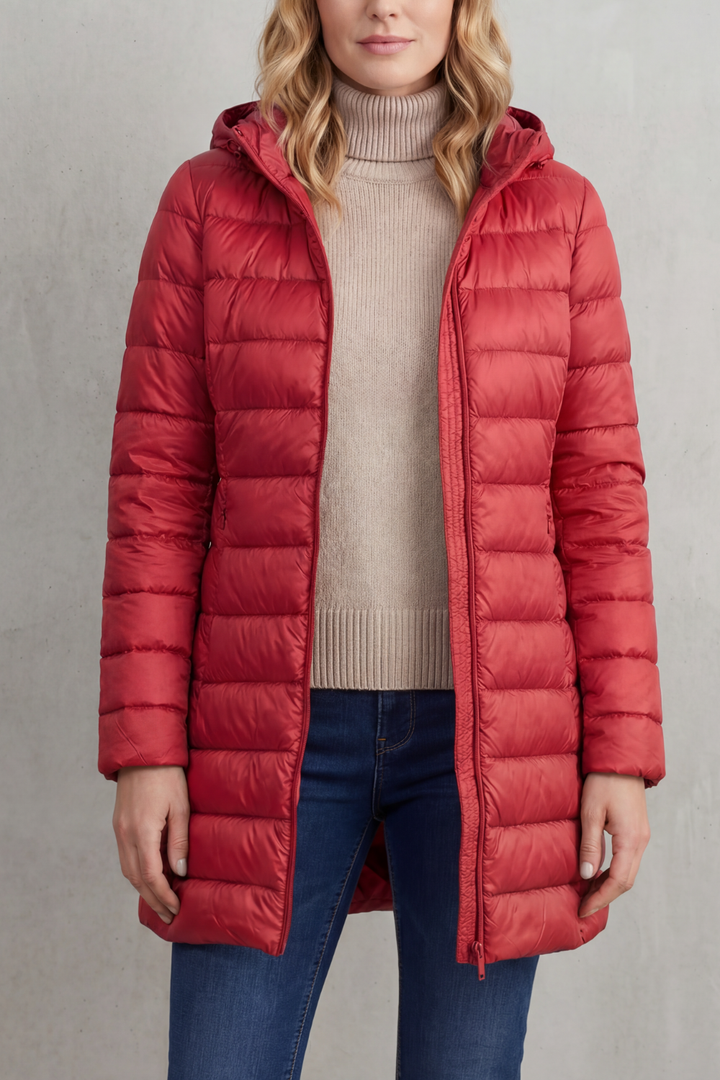 Smart women's hooded puffer. Ultra-warm, lightweight, and easily packable, blending function with winter fashion.