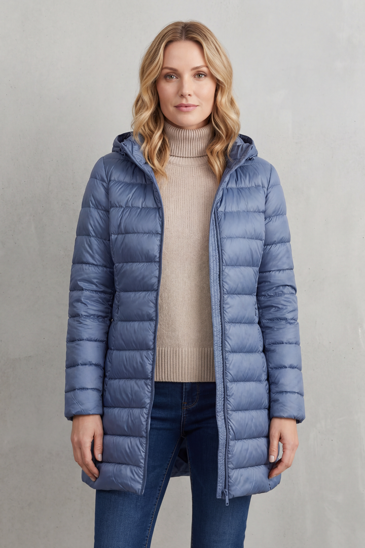 Stay cozy & stylish in this women's ultra-warm hooded puffer jacket. Lightweight, packable, ideal for winter fashion.