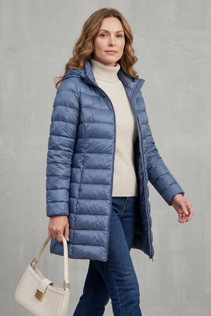 Comfortable women's packable hooded puffer jacket. Lightweight design for travel, offering premium warmth & casual style.