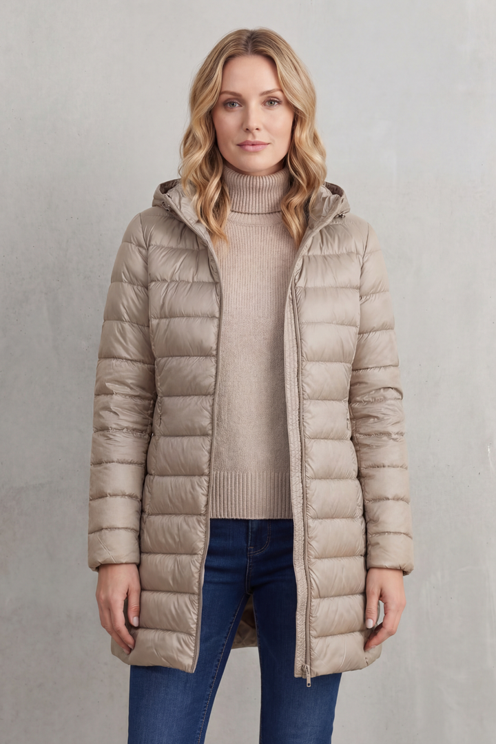 Everyday women's hooded puffer jacket. Ultra-warm, lightweight, and packable for casual style and comfort.