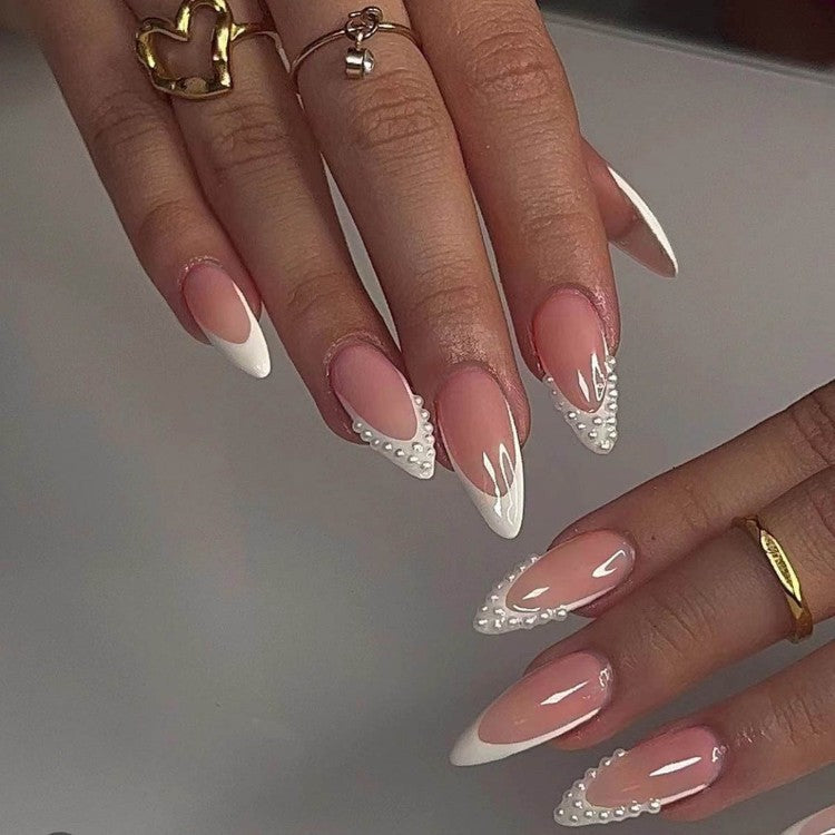 Women's premium pearl acrylic press-on nails, elegant white false nails with lustrous finish for a sophisticated manicure.