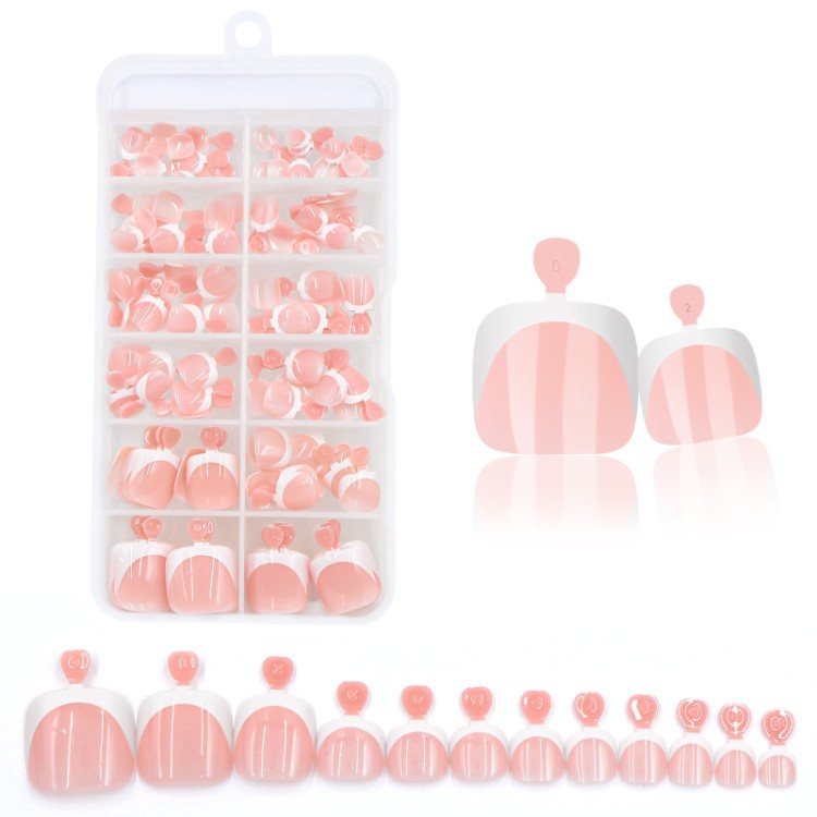 Women's press-on nail kit featuring fashionable nude and chocolate tones for stylish fake nails.