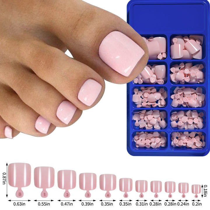 Set of various size soft gel toenail tips, ready for professional pedicure application.