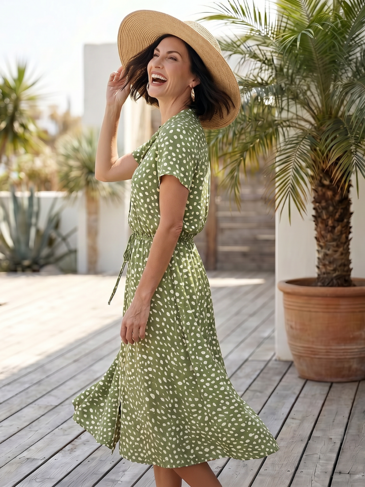 Stylish women's printed midi dress with button front & adjustable belt, ideal for everyday wear.