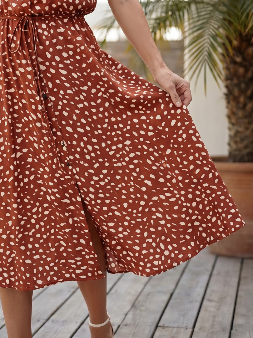 Fashionable women's short sleeve printed midi dress, button-down design & a flattering belted waist.