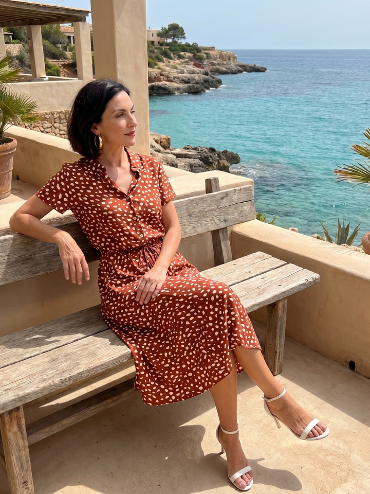 Trendy women's printed midi dress, button-front style, short sleeves, perfect for casual summer outfits.