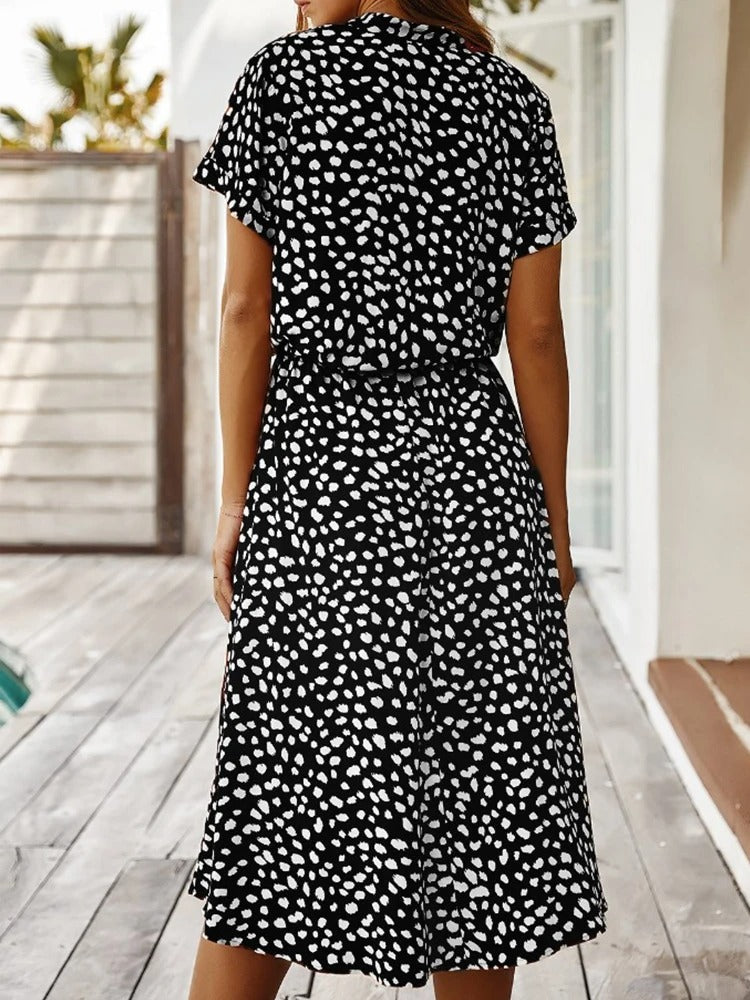 Fashionable women's lightweight midi dress with a unique print, perfect for any summer occasion.