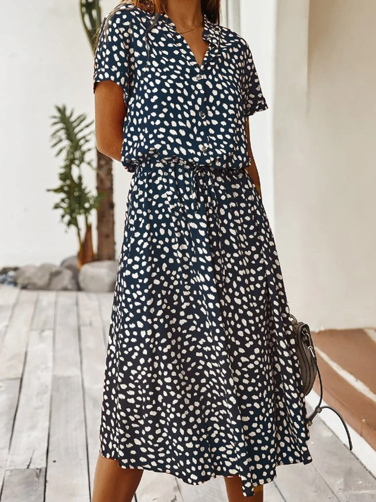 Elegant women's summer midi dress, lightweight fabric, and short sleeves for a casual look.