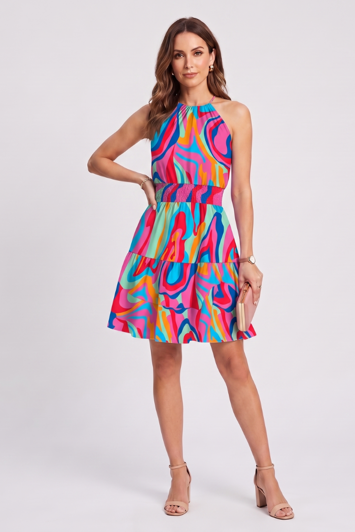 Chic printed summer playsuit for women, V-neck, sleeveless, adjustable waist, great for holidays.