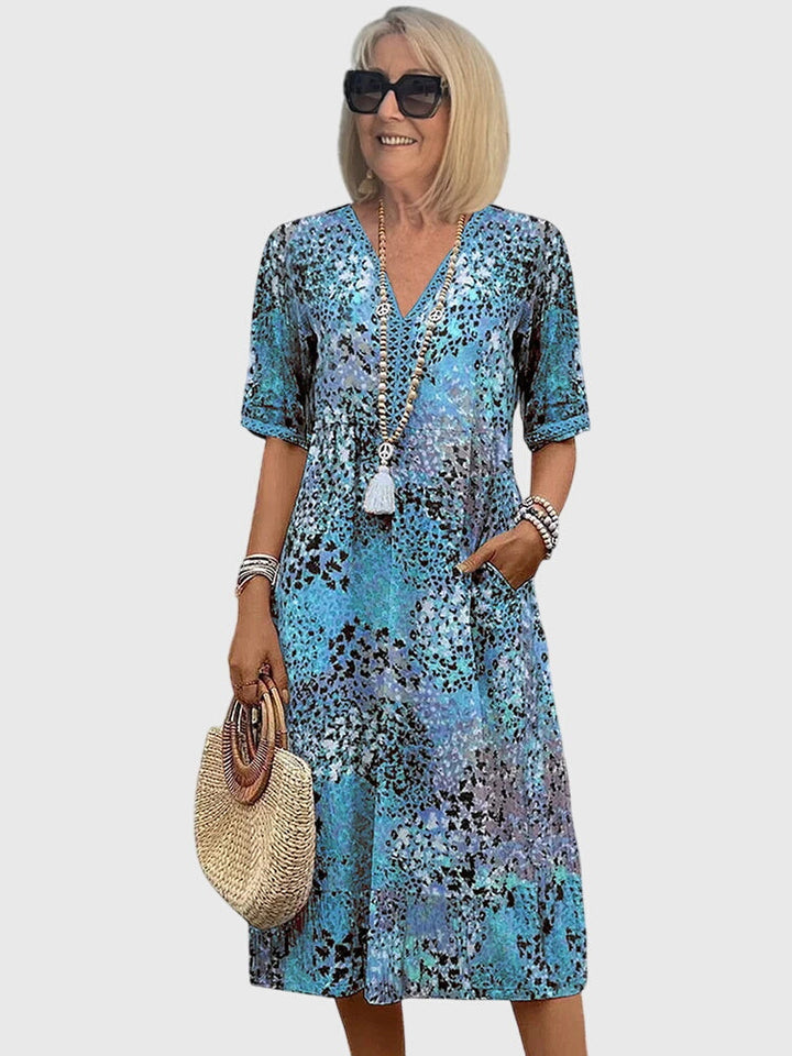 Casual women's printed midi dress for warm weather. Comfortable V-neck day dress, great for spring and summer.