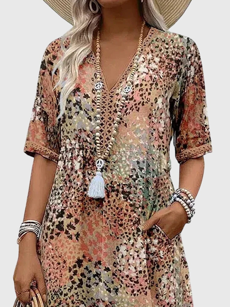 Beautiful women's printed midi dress featuring a flattering V-neckline. Ideal spring/summer casual or day dress.
