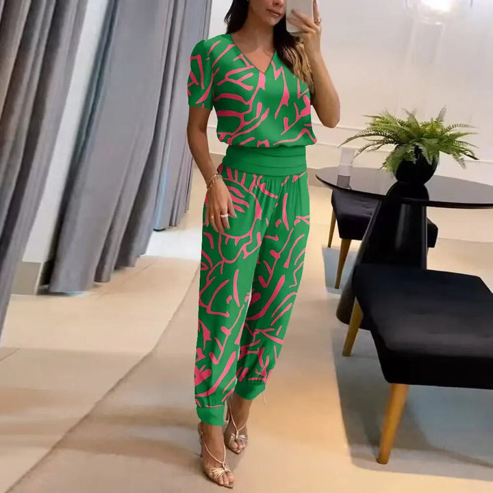 Women's printed v-neck wide leg jumpsuit. Relaxed fit, stylish design for casual or elegant summer fashion.