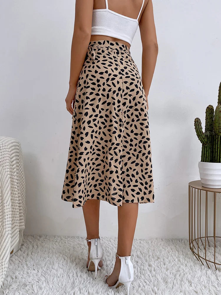 Flowy women's printed wrap skirt with tie waist. Ideal casual summer midi skirt for a boho vacation look.