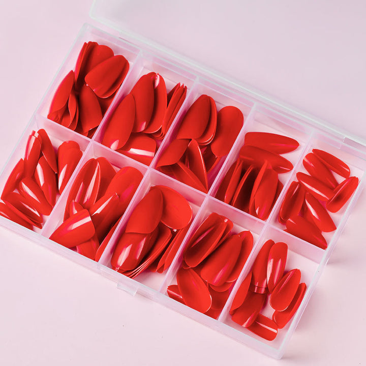 Assorted fake press-on nails from a 120-piece kit, perfect for quick, professional artificial manicures.