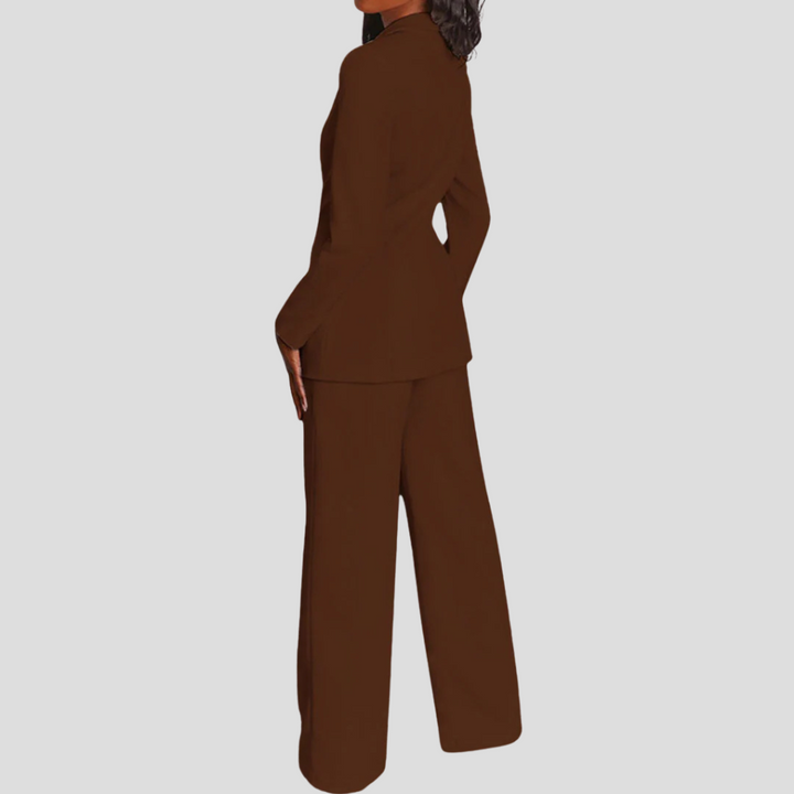 Women's tailored blazer set with straight-leg trousers. Elegant and refined for any professional setting.