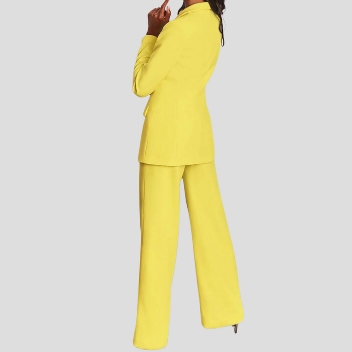 Chic women's tailored blazer and matching straight-leg trousers. Elegant two-piece professional set.