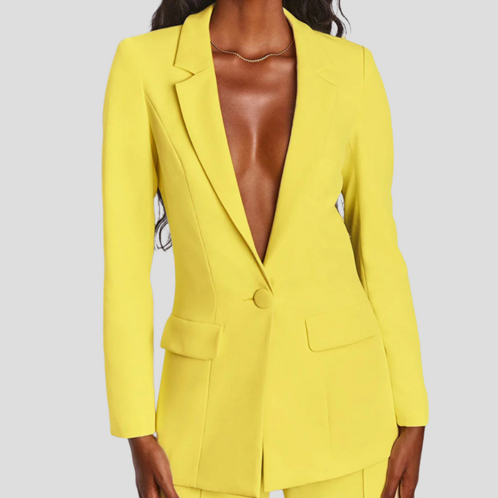 Stylish women's business suit. Coordinated blazer and straight-leg trousers for formal office wear.