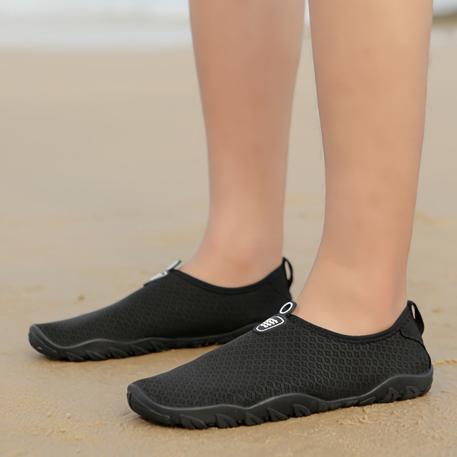 Non-slip women's water shoes with quick-dry mesh upper. Perfect for beach and water sports, secure grip.