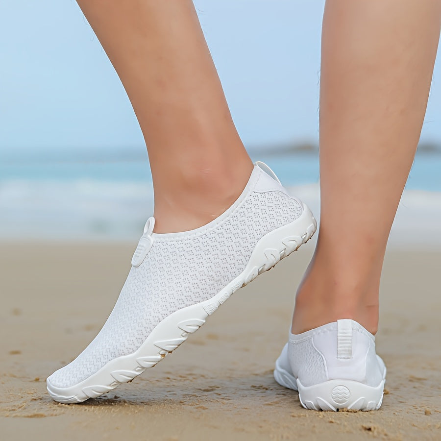Versatile women's aquatic shoes for beach, swimming, and water sports. Quick-dry comfort, non-slip grip.