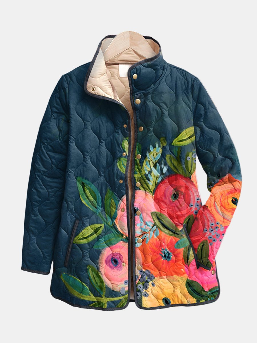 Women's quilted floral print jacket with snap front, stand collar. Stylish spring/fall outerwear for casual chic.