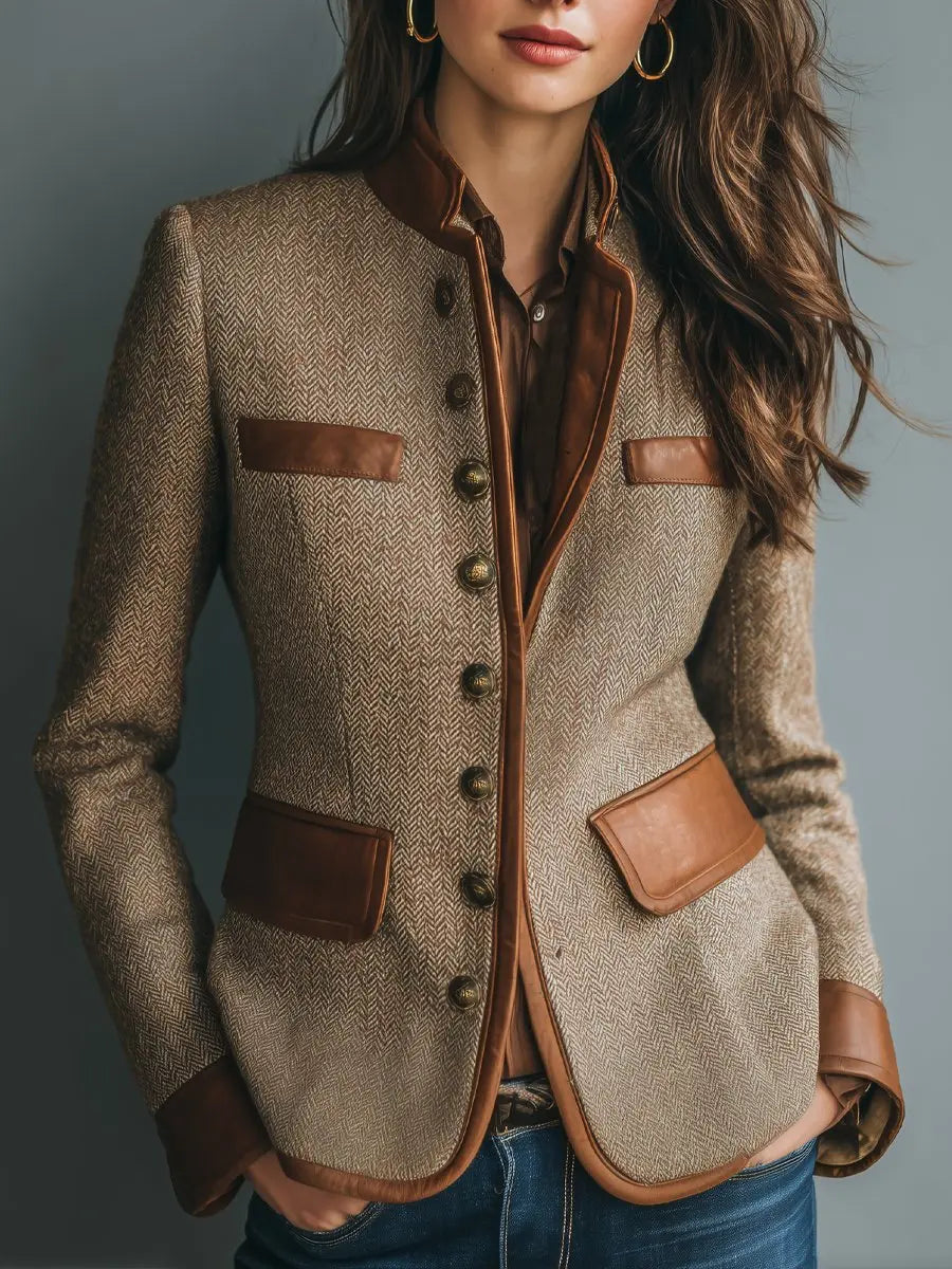 Women's quilted herringbone blazer with elegant faux leather trim, perfect for a chic smart casual look.