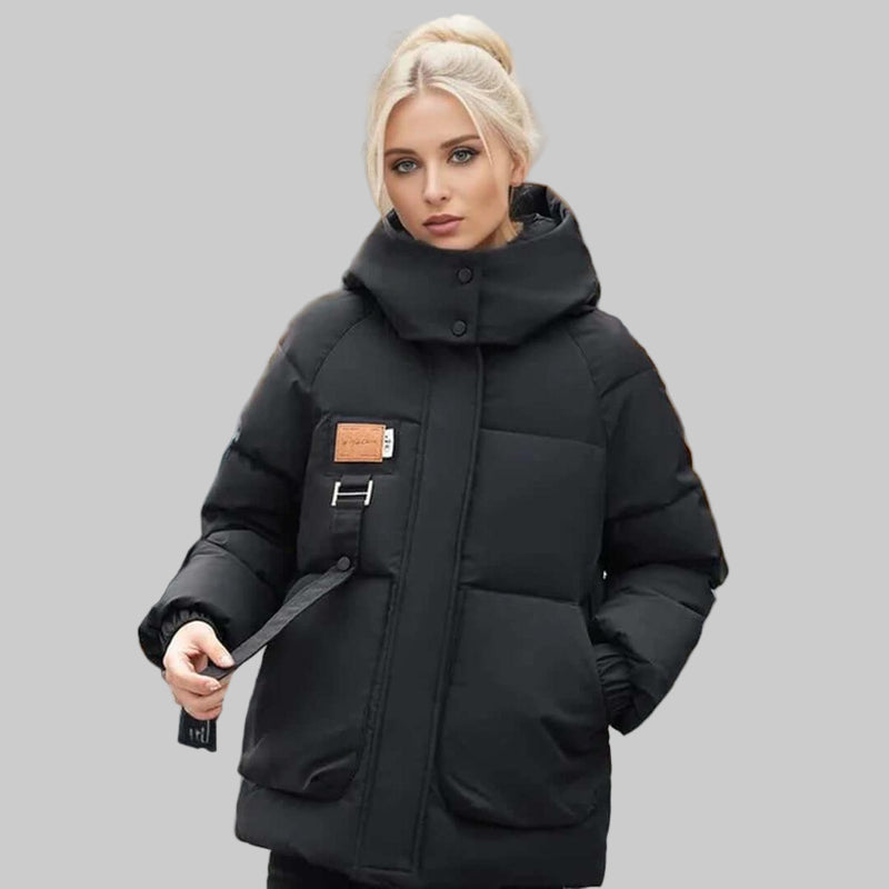 Stylish women's quilted hooded jacket with a relaxed fit. Ideal casual outerwear for fall fashion and comfort.