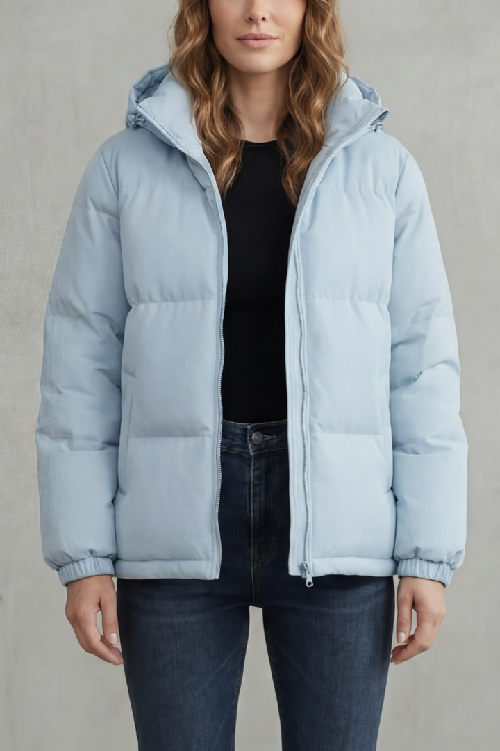 Women's quilted hooded puffer jacket, lightweight & warm for versatile everyday style.