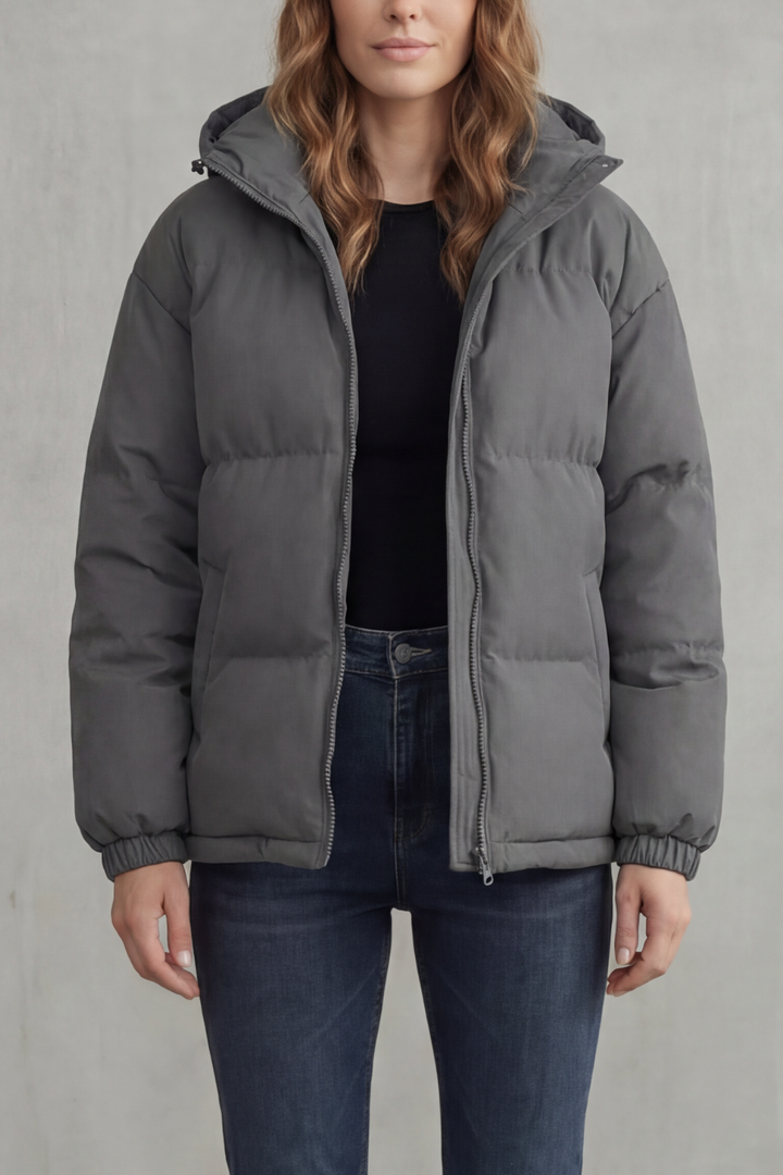 Cozy women's quilted hooded puffer jacket, lightweight and warm for ultimate comfort outdoors.