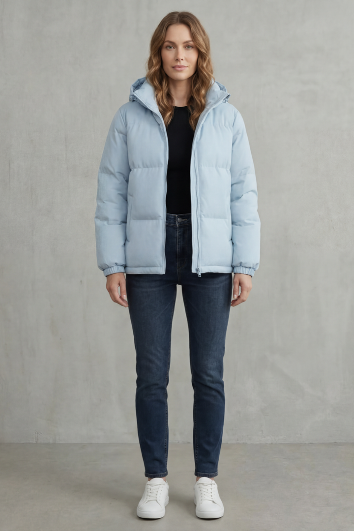Warm women's quilted hooded puffer jacket, ideal lightweight winter outerwear for comfort.