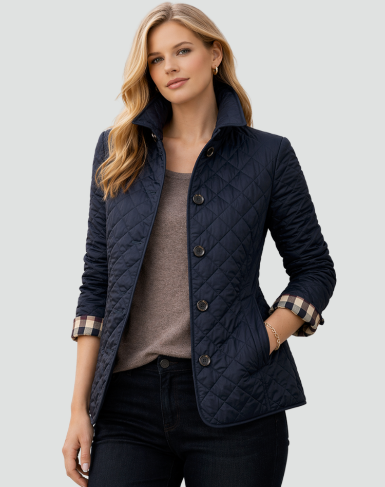 Close-up of the button-front closure on a women's quilted lightweight outerwear jacket. Smart casual style.