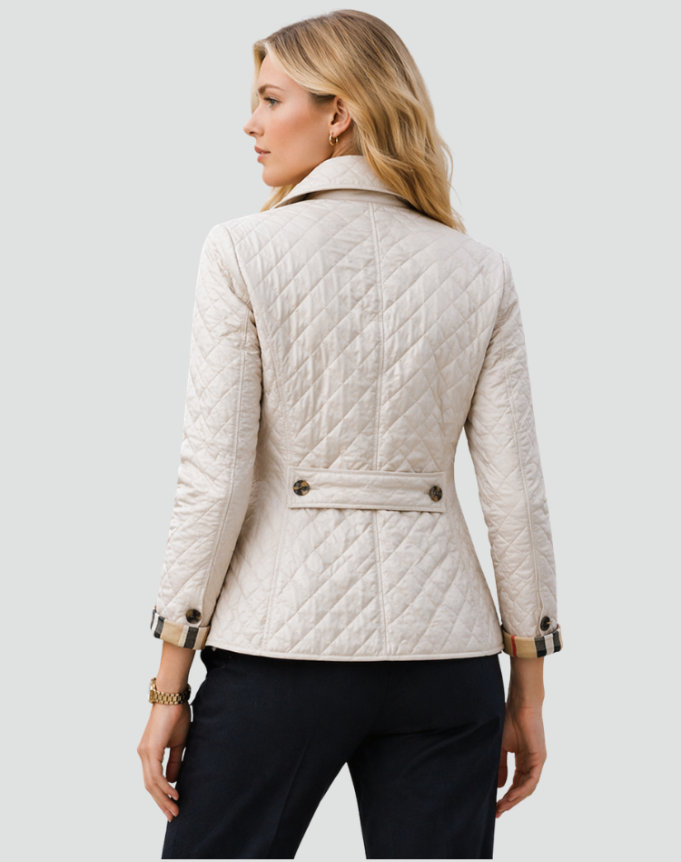 Women's casual quilted jacket, designed for comfortable mid-season wear. Lightweight outerwear with classic buttons.