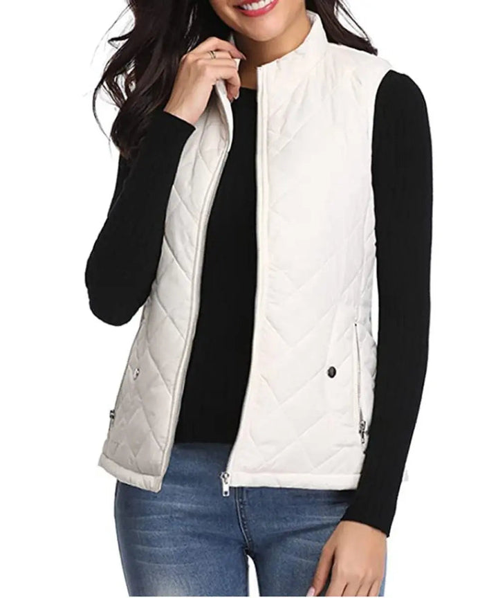 Modern women's quilted puffer vest, sleek transitional outerwear for all seasons.
