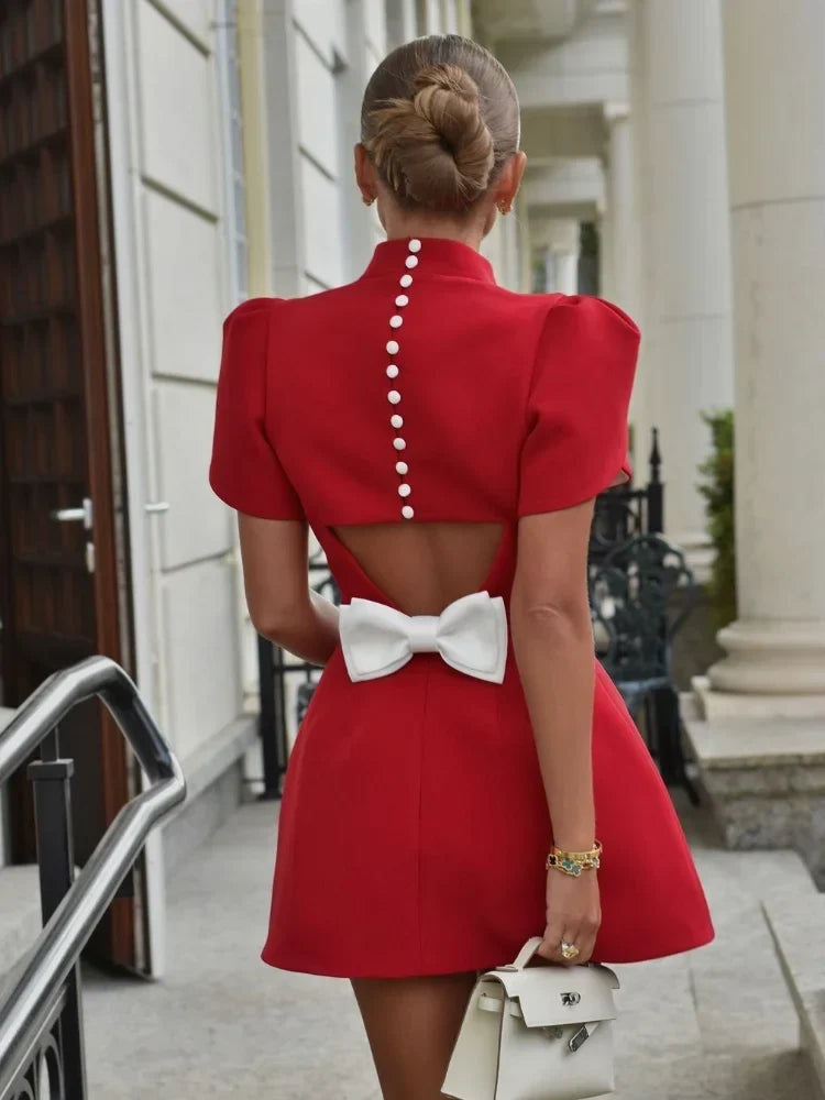 Women's red chic skater dress with elegant back bow detail, perfect for parties & special occasions.