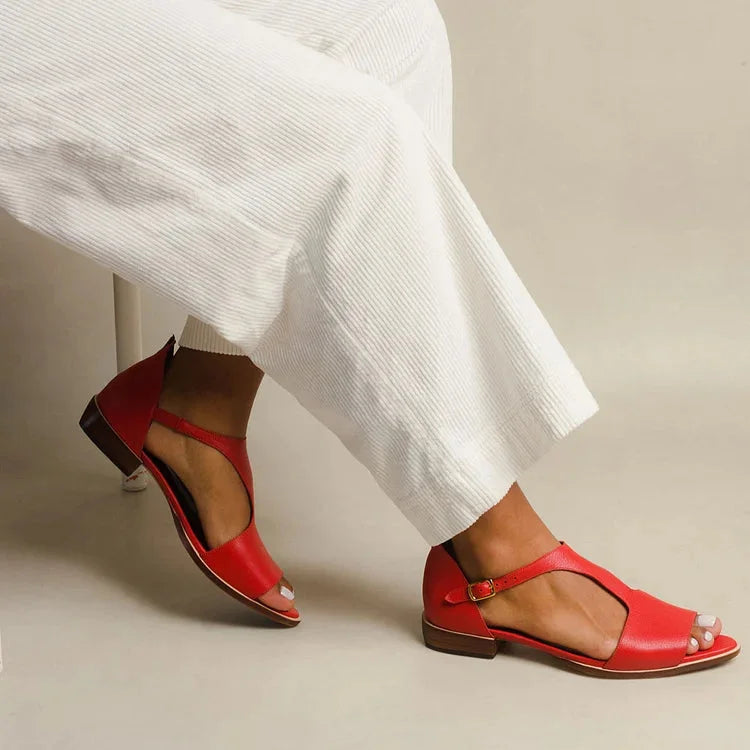Women's red flat sandals with T-strap & buckle closure, ideal for comfortable, versatile summer casual chic style.