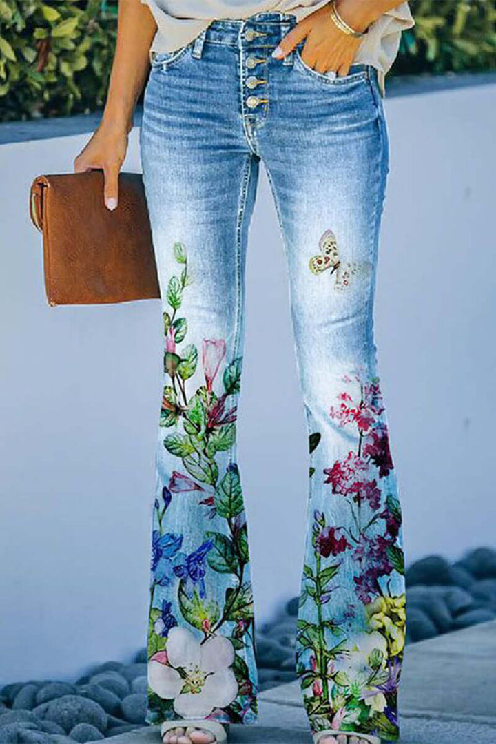 Blue denim women's regular fit jeans featuring intricate floral embroidery. Durable, stylish & comfortable pants.