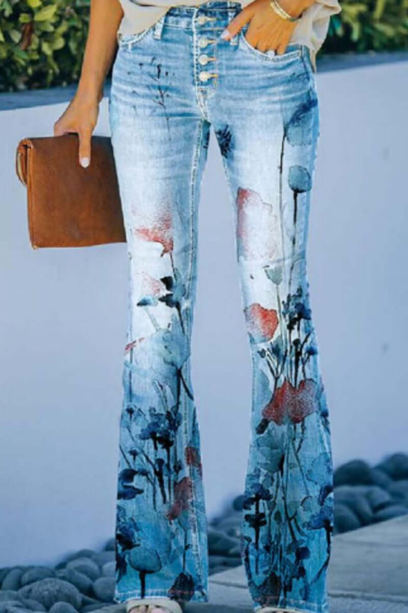 Back view: Women's comfortable regular fit blue denim jeans with subtle floral embroidery accents. Casual & stylish.