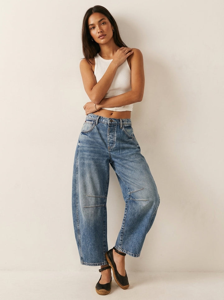 Casual women's high-waist denim jeans with a fashionable barrel leg, perfect for everyday style.