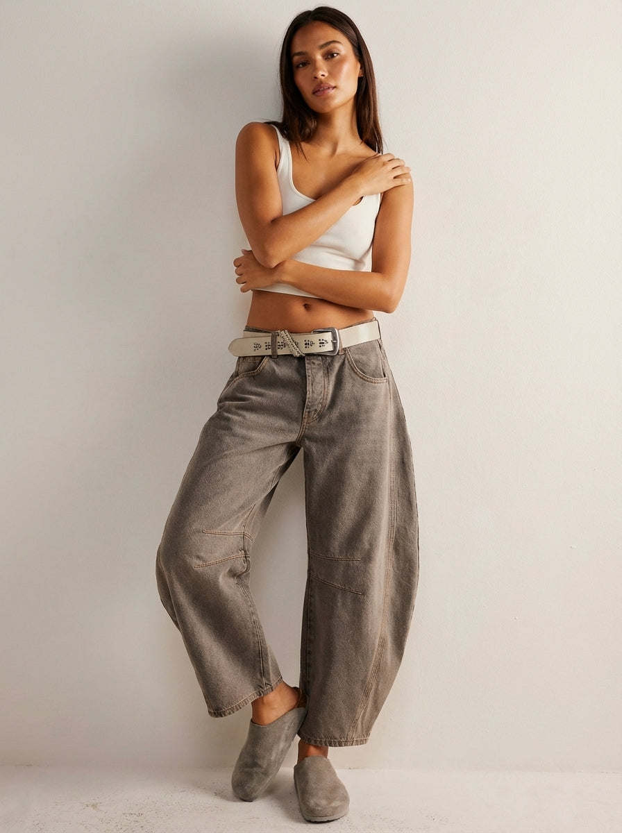 Blue denim high-waist barrel leg jeans for women, featuring a relaxed fit for versatile casual outfits.