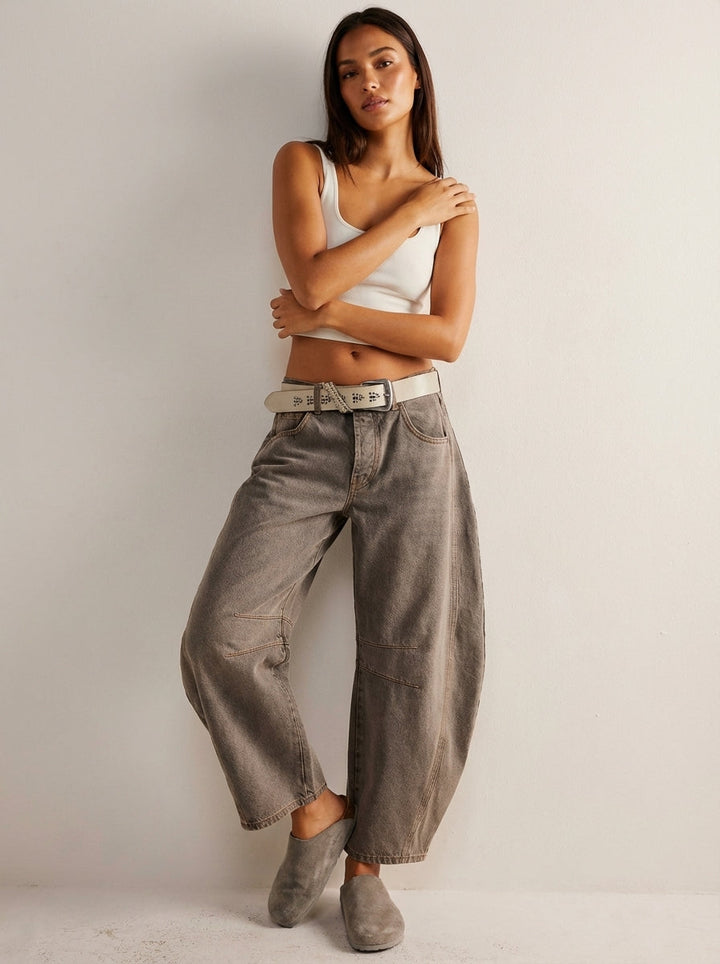 Blue denim high-waist barrel leg jeans for women, featuring a relaxed fit for versatile casual outfits.