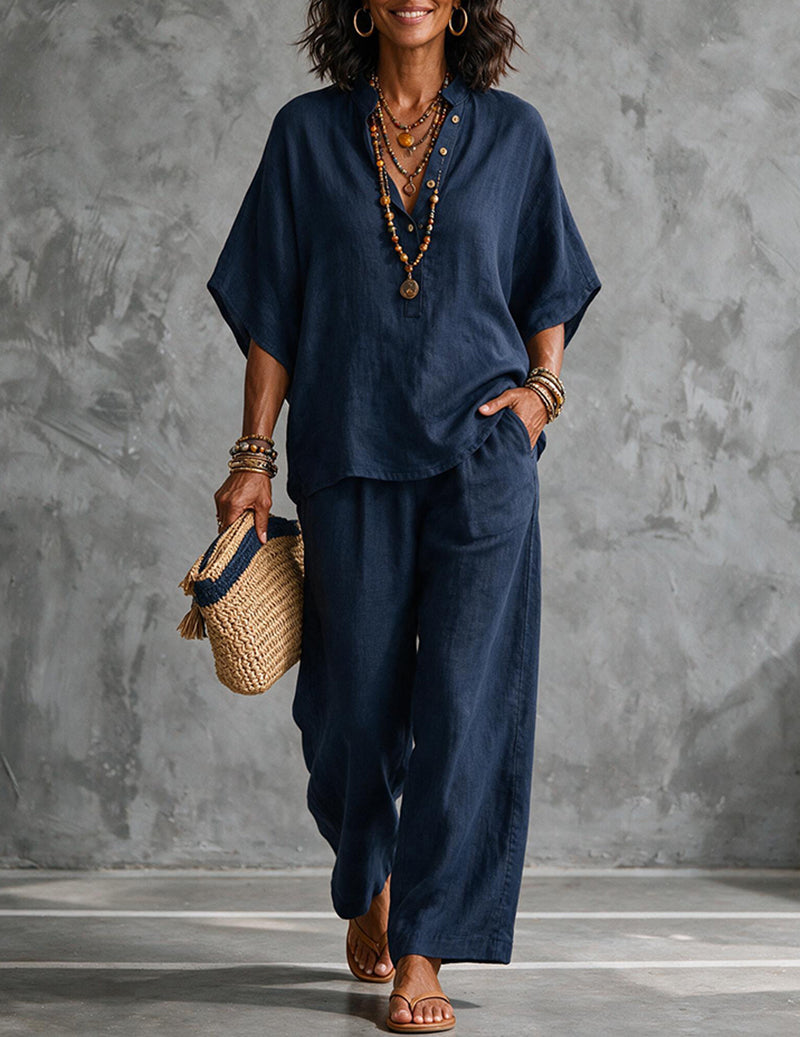 Elegant women's matching set: Flowy batwing top & wide-leg trousers, perfect for resort wear.
