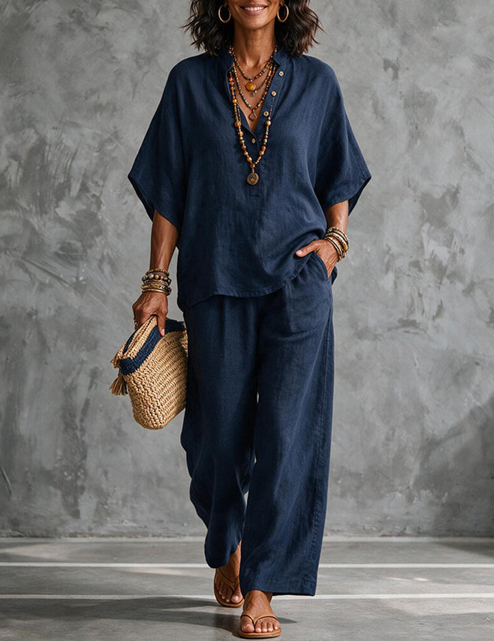 Elegant women's matching set: Flowy batwing top & wide-leg trousers, perfect for resort wear.