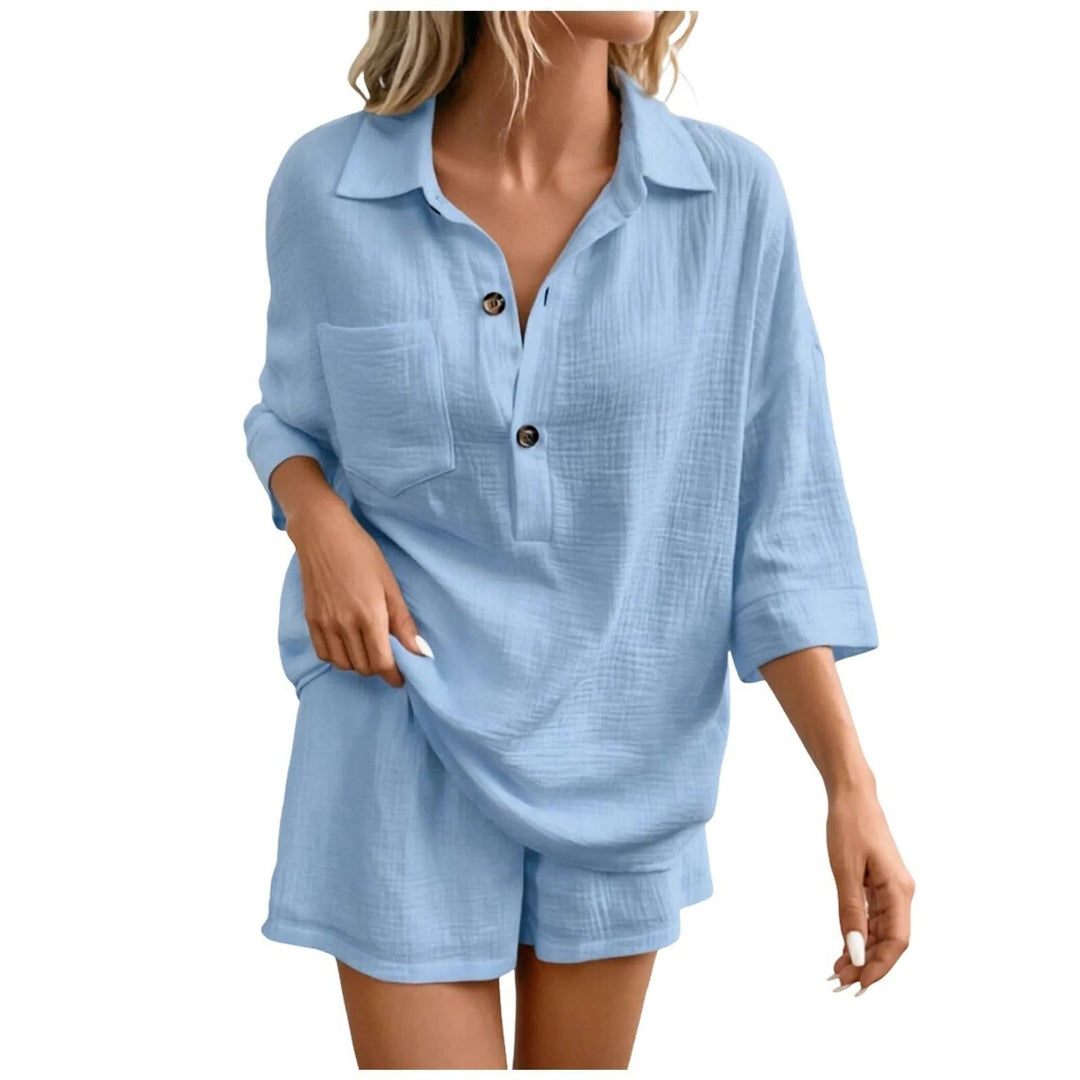 Black women's two-piece relaxed shirt and shorts set for a stylish and comfy summer holiday look.