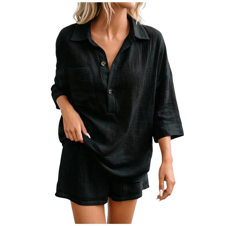 White women's relaxed co-ord shirt and shorts set, a chic and cool summer outfit for any occasion.