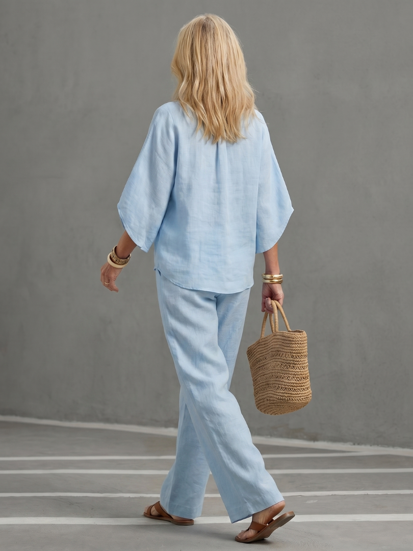 Versatile women's fashion two-piece set featuring an elbow-sleeve tunic and straight trousers.