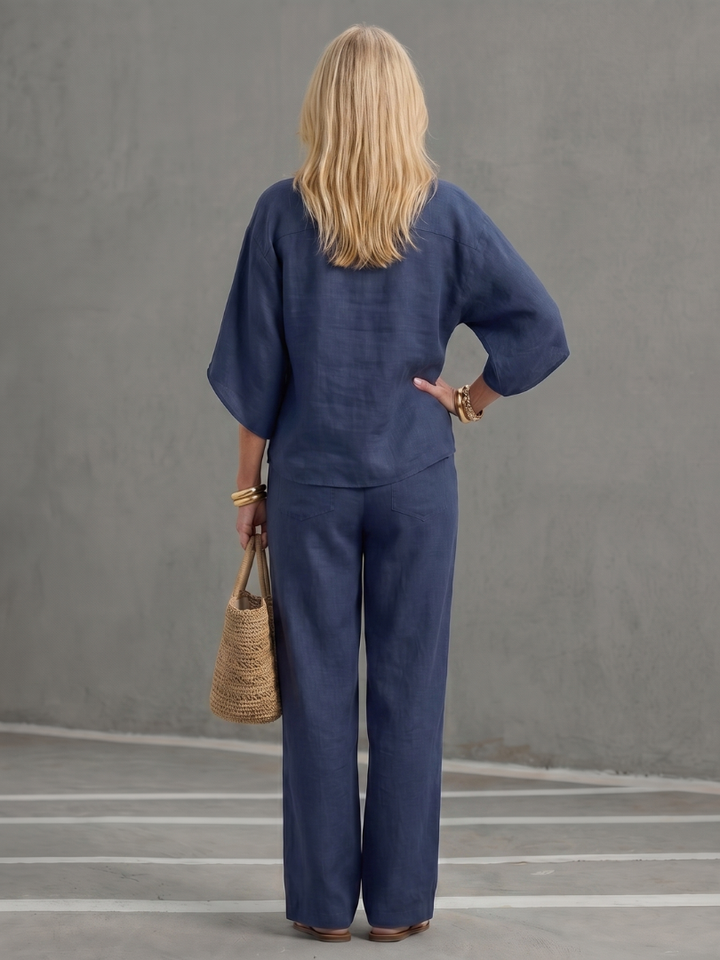 Women's two-piece set: button front tunic with elbow sleeves & straight-leg trousers. Relaxed fit.