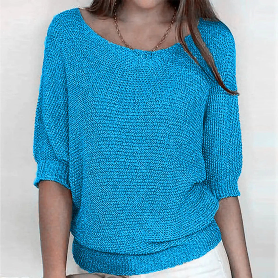 Model wearing a comfortable women's batwing-sleeve sweater, showing relaxed fit & casual style.