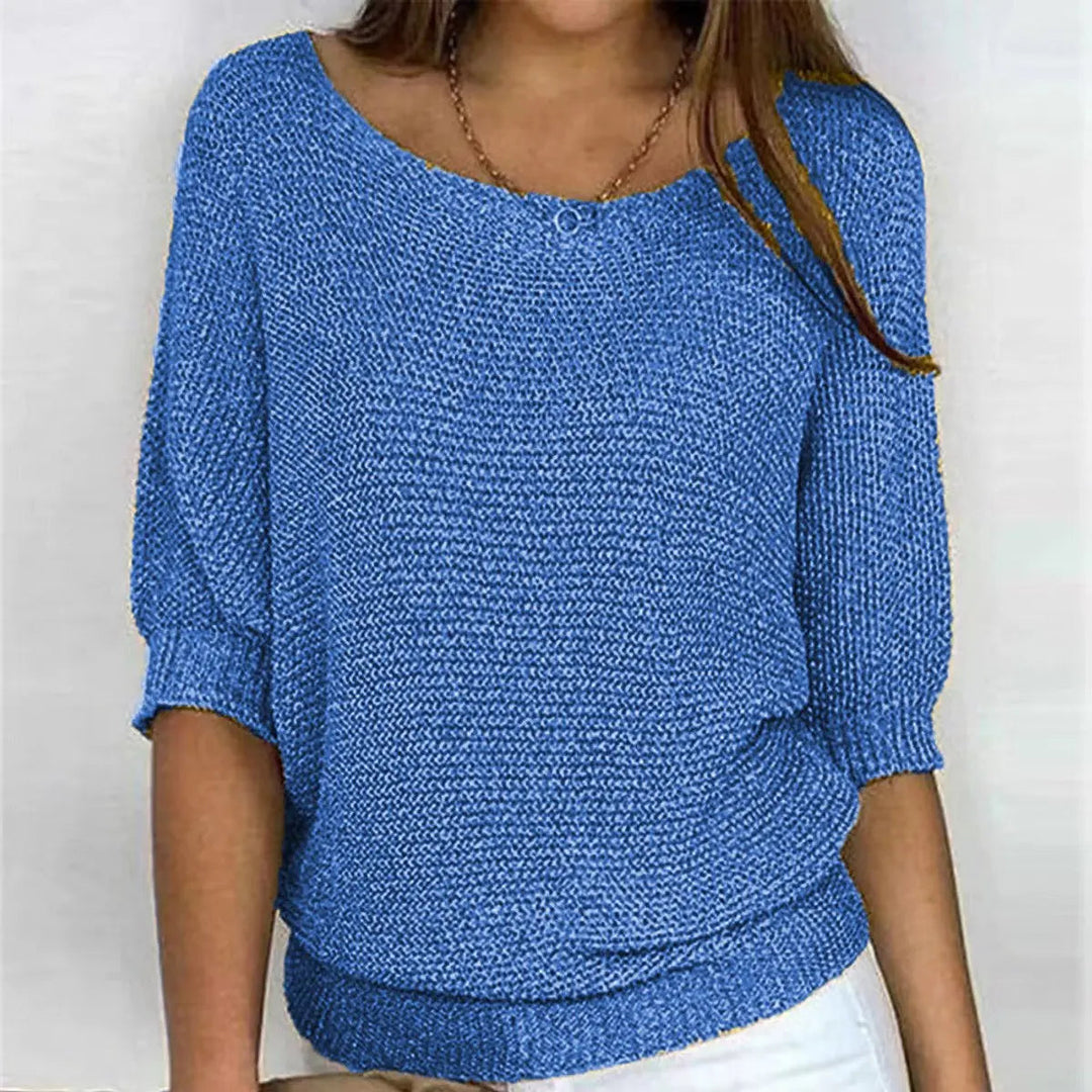 Soft women's relaxed-fit batwing-sleeve sweater, a versatile top for everyday comfort.